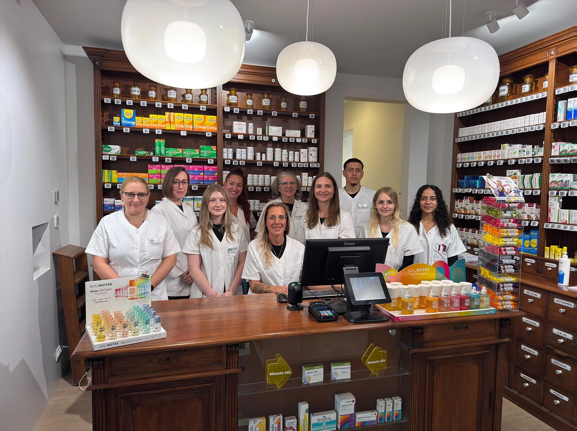 The Anklin Apotheke team behind the dispensary counter