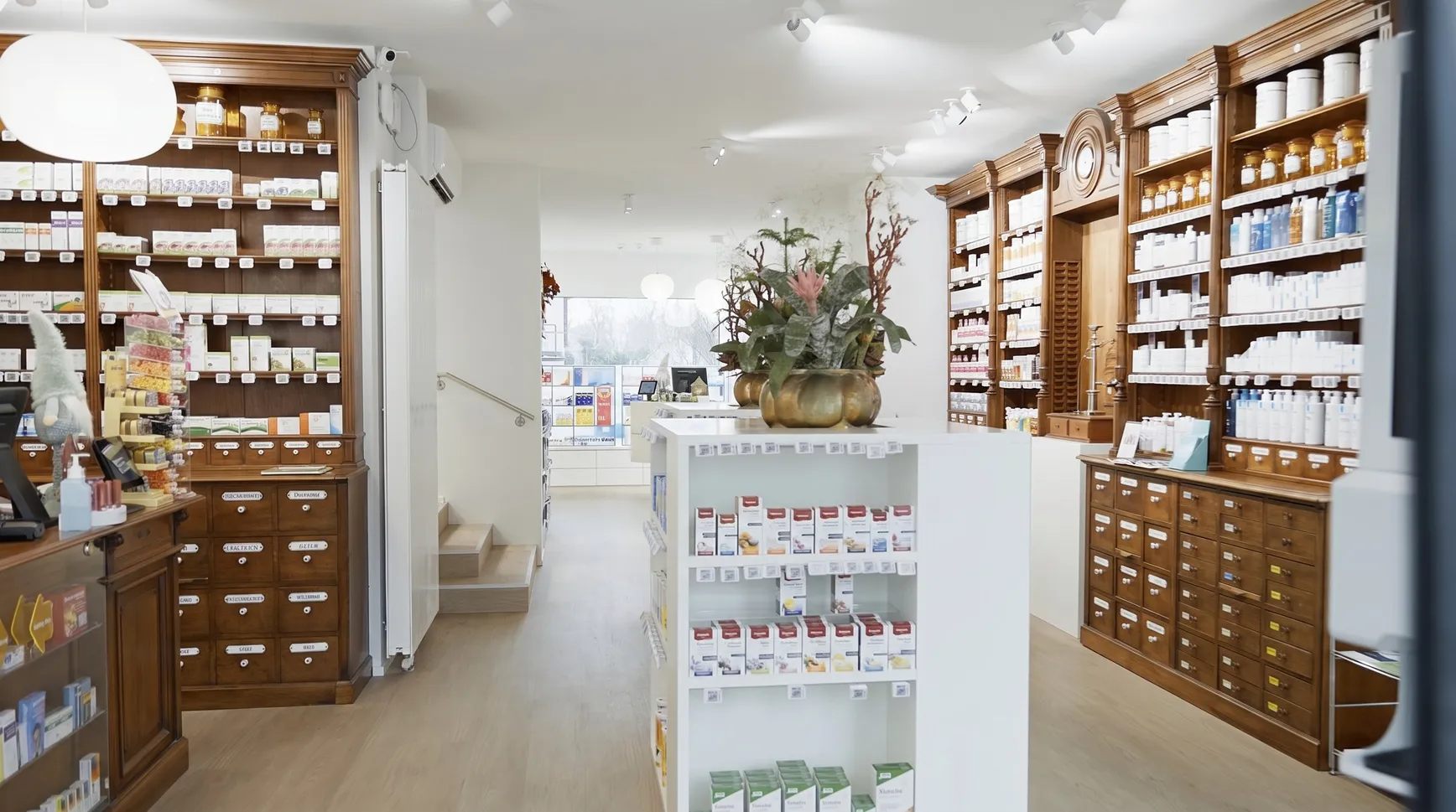 The dispensary today, bright rooms with the historic wooden shelves